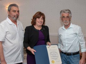 Assemblywoman Marianne Buttenschon presents citation to Director Ed Morgan (left) and Advisory Board Chair John Sullivan.